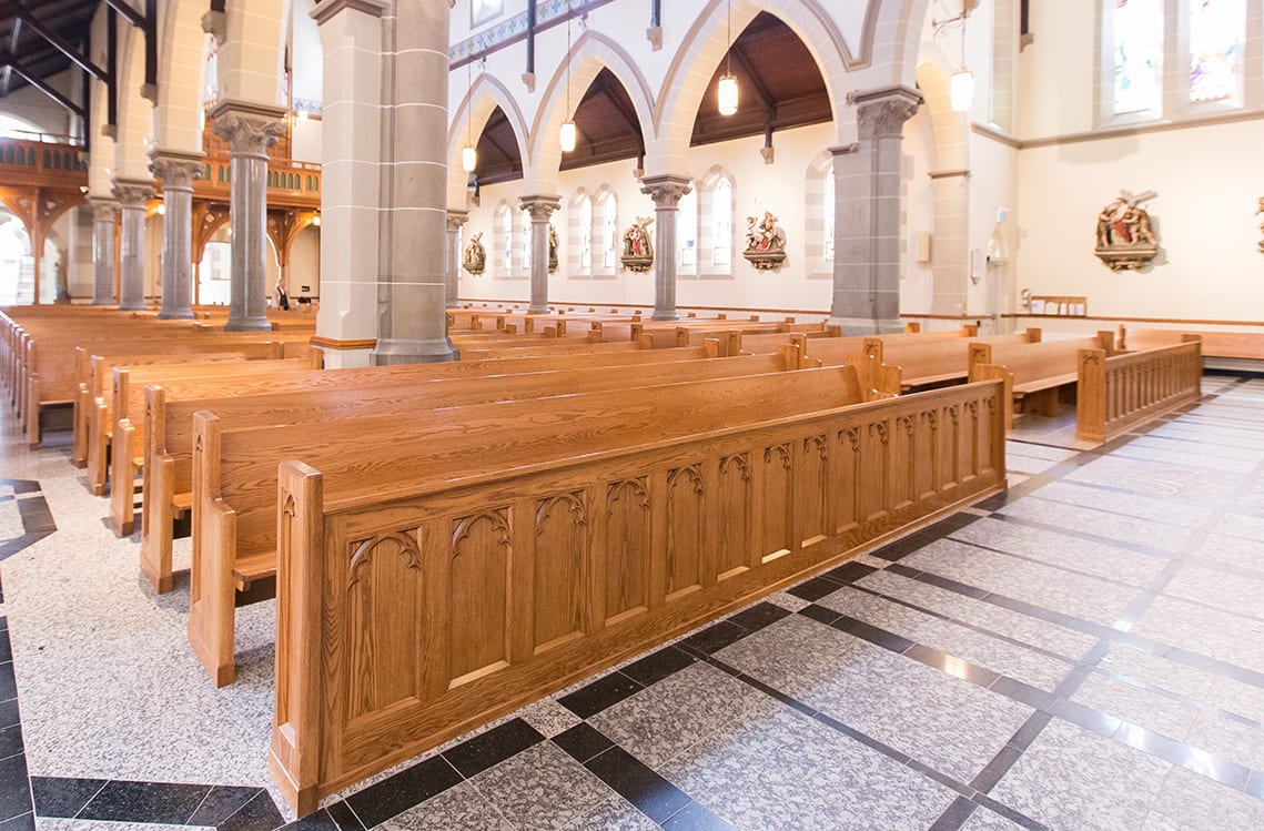 The Evolution and Significance of Catholic Pews image